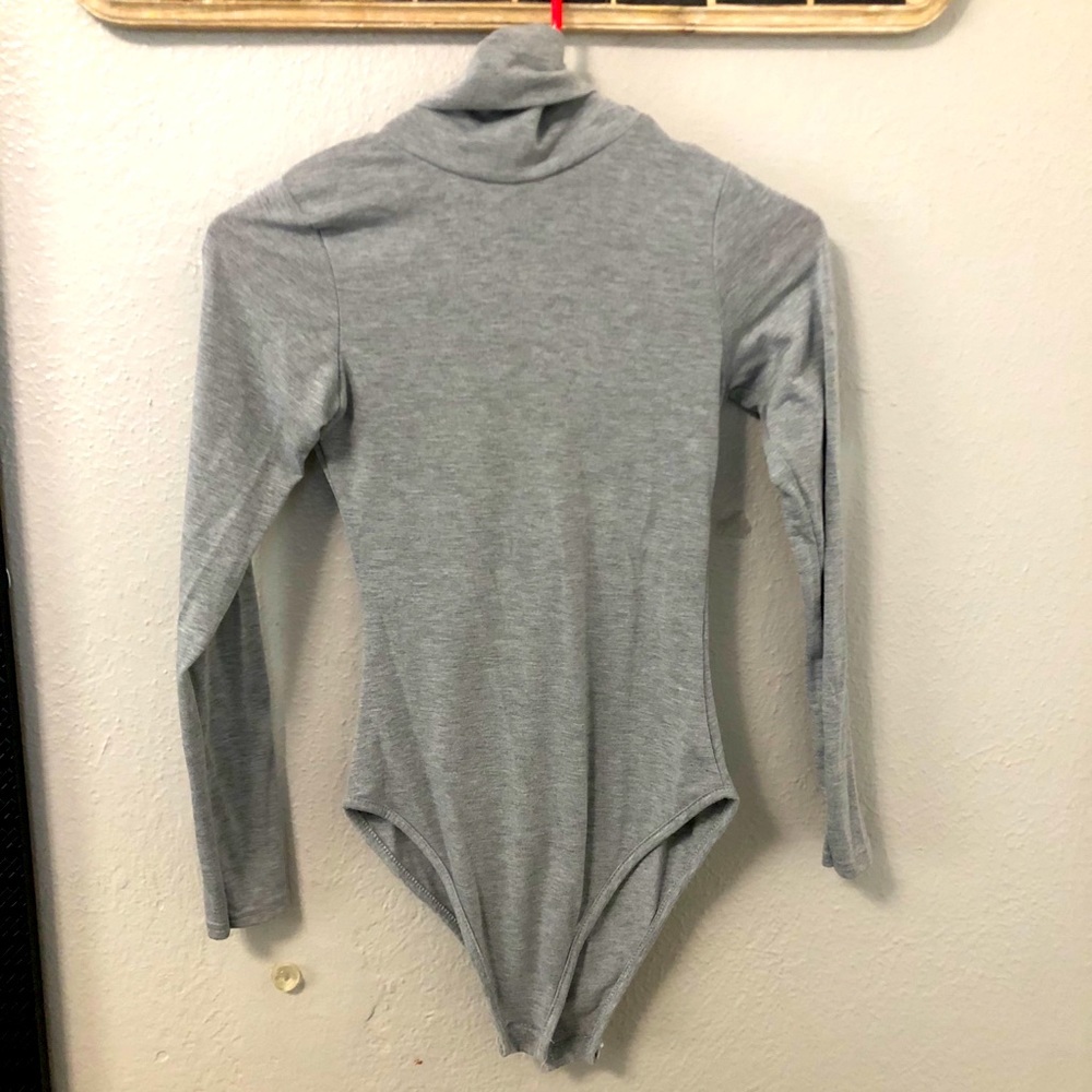 Light gray turtle neck body suit